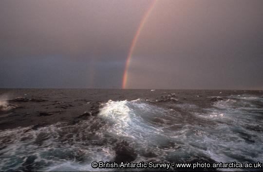 Rainbow seen on a stormy day at sea