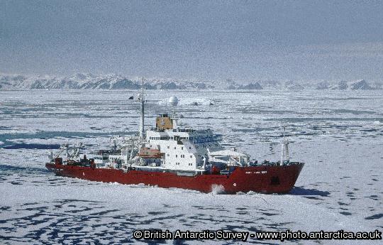 RRS James Clark Ross in pack ice, in Marguerite Bay, close to Rothera research station. The mountains of the Antarctic Peninsula are in the background.