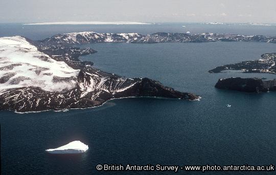 Deception Island, South Shetland Islands, showing the 10km diameter flooded caldera.  The caldera collapsed approximately 10,000 years ago following a major eruption. Several smaller eruptions occurred between 1967 and 1970. The island is visited by around 10,000 tourists each year.