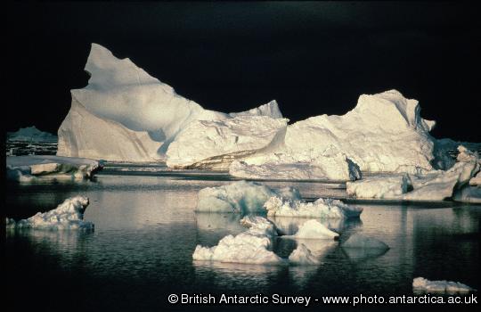 Iceberg in North Bay. Black background caused by approaching storm.