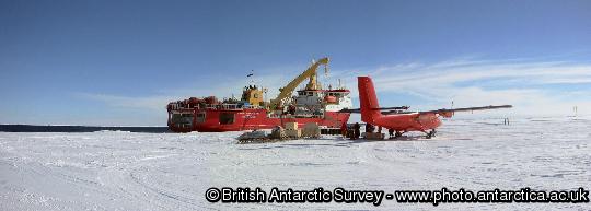 A BAS twin otter aircraft on the sea ice at Dresher Inlet. The aircraft is seen alongside RRS Shackleton during the airborne relief of Halley Research Station.