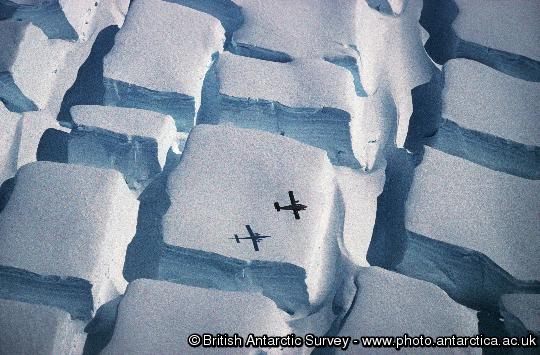 BAS Twin Otter flying low over a striking crevasse field on the English Coast, Palmer Land on the Antarctic Peninsula.  
This image is associated with the 2005-2010 BAS science programme: GEACEP (Greenhouse to Ice-House Evolution of the Antarctic Cryosphere and Palaeoenvironment).