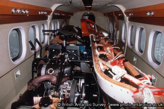 Interior of a BAS Twin Otter, fully loaded with cargo.