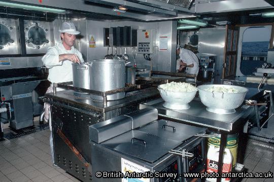 A cook in the  galley onboard of RRS James Clark Ross