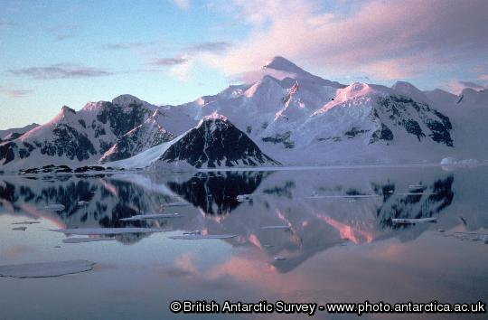 Adelaide Island from Rothera and clouds relectd in a calm sea