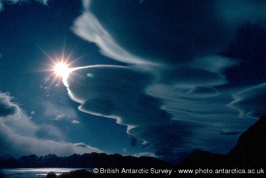 A stack of plate clouds above South Georgia - altocumulus lenticularis - stationary wave clouds caused by airflow over mountains