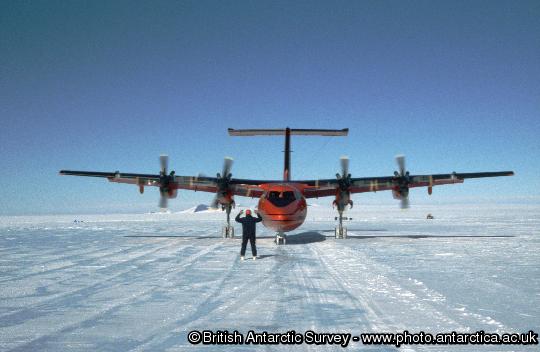 Dash 7 being directed to cargo stance at Sky-Blu. The wheeled Dash 7 aircraft routinely operates between Rothera and a blue ice runway at Sky-Blu where a fuel depot is maintained for use by the fleet of Twin Otter aircraft.