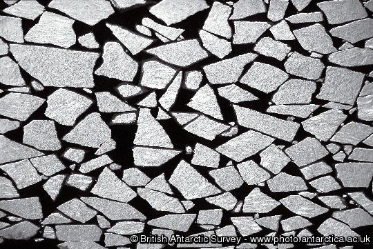Sea ice breaking up in the summer.  Taken from an aircraft en-route from Halley to George von Neumayer Station, close to the coastline north west of Halley.