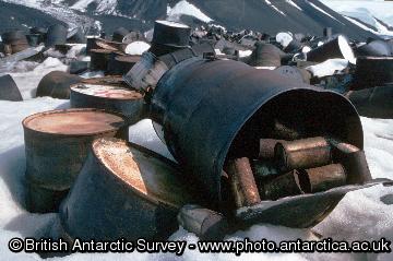 Old fuel drums and food tins at fossil Bluff waste dump before removal from Antarctica in the summer of 1994/5
