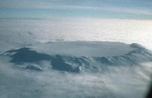 Aerial view pf the 5-6 Km Diameter Ice-filled summit caldera and upper slopes of Mt Hampton, a mid-Miocene alkaline stratovolcano in the Executive Committee Range, investigated by British and American geologists as part of the WAVE (West Antarctic Volcano Exploration) project.