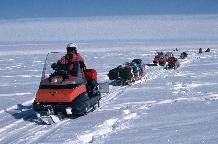 A remote field party travelling between sites using Bombardier skidoos and Nansen Sledges.  The party of four required more than 6 tonnes of equipment but were autonomous for 10 weeks. Snow-mobiles are extensively used at the BAS stations and at remote field locations. These small vehicles are used for personal transport and for towing Nansen sledges. BAS operates Bombardier Ski-doos which are simple to ride with just a twist grip throttle and a brake. They have a fully automatic transmission and a track underneath with skis at the front to steer. Ski-doos can attain speeds of up to 50 mph on smooth snow.