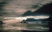 Adelaide Island from Rothera and clouds relectd in a calm sea