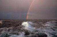 Rainbow seen on a stormy day at sea