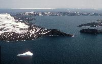 Deception Island, South Shetland Islands, showing the 10km diameter flooded caldera.  The caldera collapsed approximately 10,000 years ago following a major eruption. Several smaller eruptions occurred between 1967 and 1970. The island is visited by around 10,000 tourists each year.