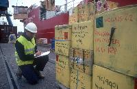 John Shears checks Hazadous waste being unloaded from RRS Shackleton at Grimsby docks