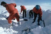 Shovelling snow into the melt tank to provide the fresh water at Halley Research Station