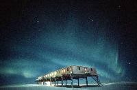 Aurora over Halley 5 ACB.  Aurora are caused by the precipitation of charged particles from space towards the magnetic poles driven by plasma winds and magnetic storms.