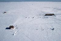 Aerial view of the Halley Research station showing the three platforms. The Simpson building is in the foreground.